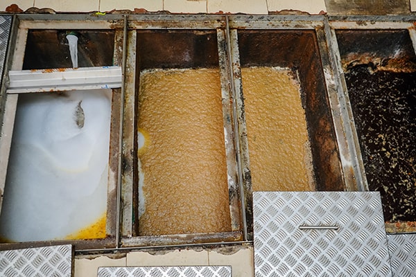 regular grease trap maintenance helps prevent plumbing issues, maintain a sanitary environment, and comply with regulations